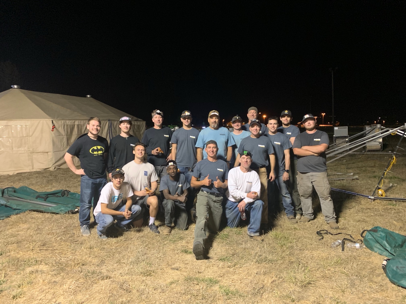 Intents crew posing together at a wildfire support camp