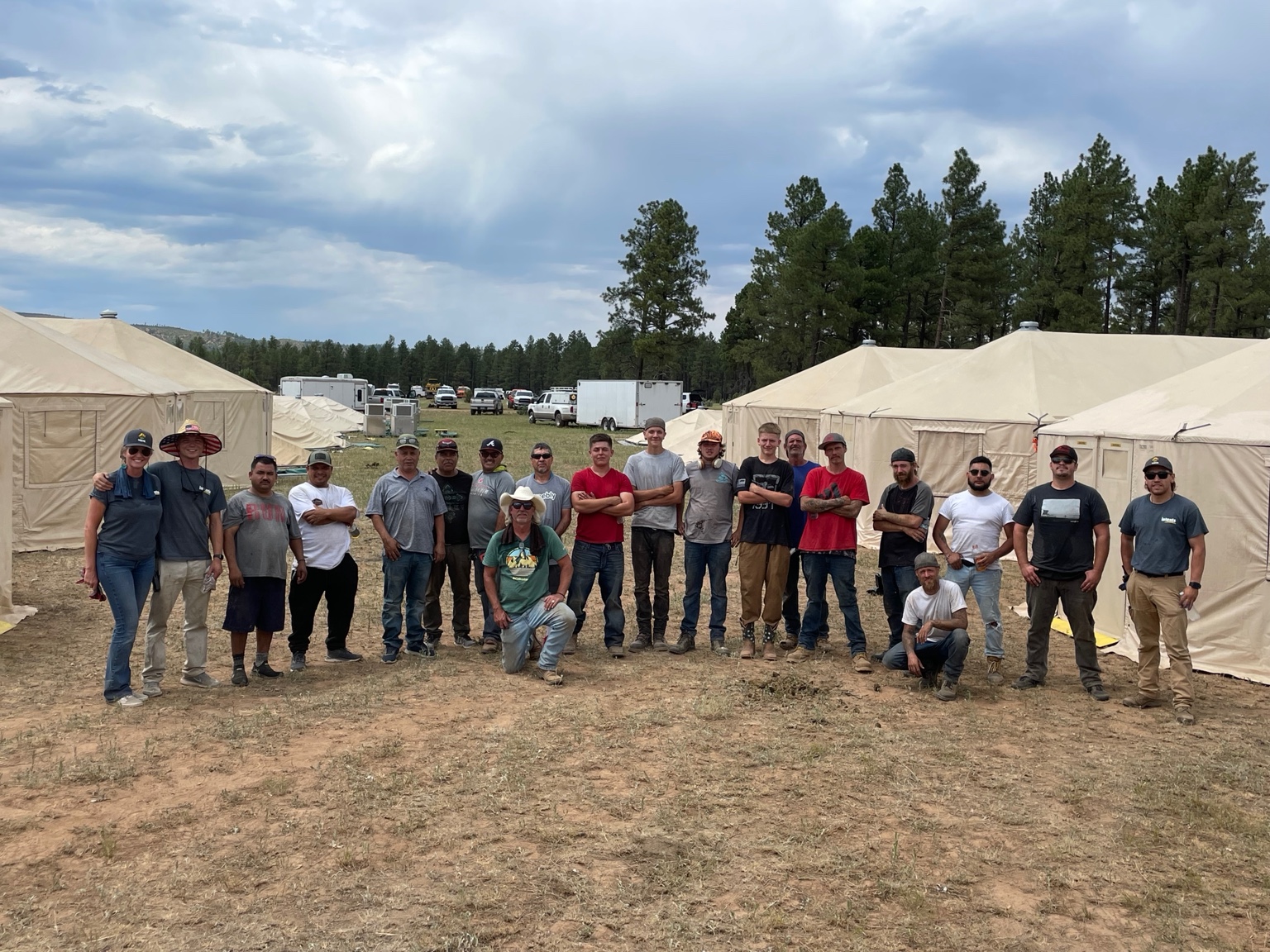 Intents team gathered between wildfire support tents