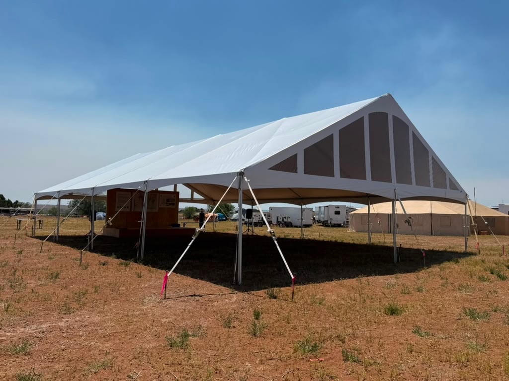 Large open-sided canopy set up at a wildfire support site